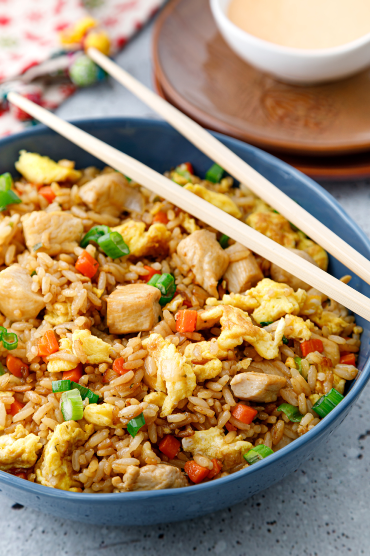 A serving of homemade Subgum Fried Rice with mixed vegetables, protein, and a golden, stir-fried texture.