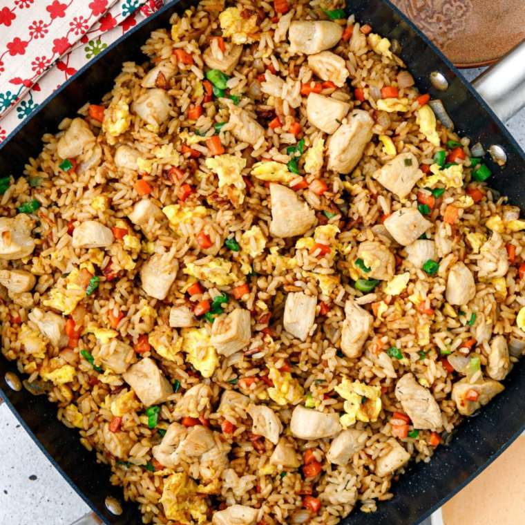 "Plate of Subgum Fried Rice with vegetables and meat"