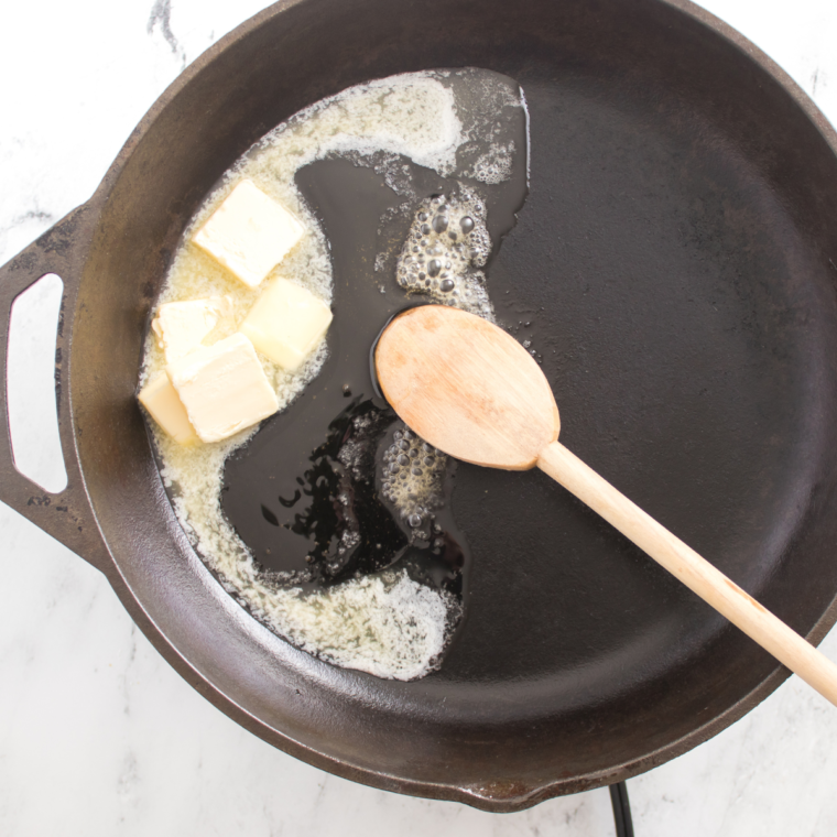 Melting butter in a saucepan for Texas Roadhouse Buttered Corn recipe.