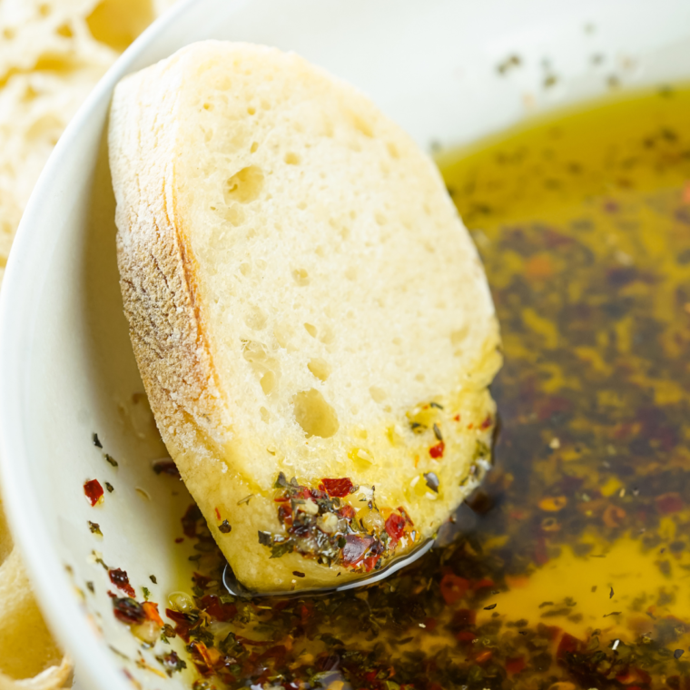 "10 Minute Mediterranean Bread Dipping Oil with olive oil, garlic, herbs, and balsamic vinegar"