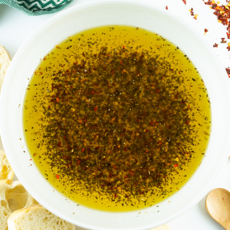 "Sprinkling salt and freshly ground black pepper into the Mediterranean bread dipping oil, mixing well and serving with warm crusty bread for dipping."