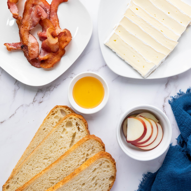 Ingredients needed for 15-Minute Apple Brie Sandwich on kitchen table.