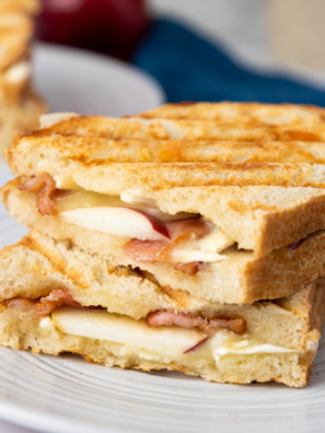 "A close-up of a 15-Minute Apple Brie Sandwich with layers of creamy brie, crisp apple slices, and toasted bread."