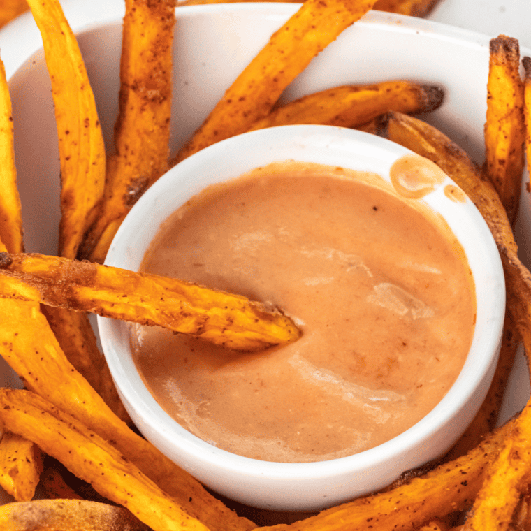 A creamy bowl of A&W Spicy Chipotle Dipping Sauce with a side of crispy fries for dipping.