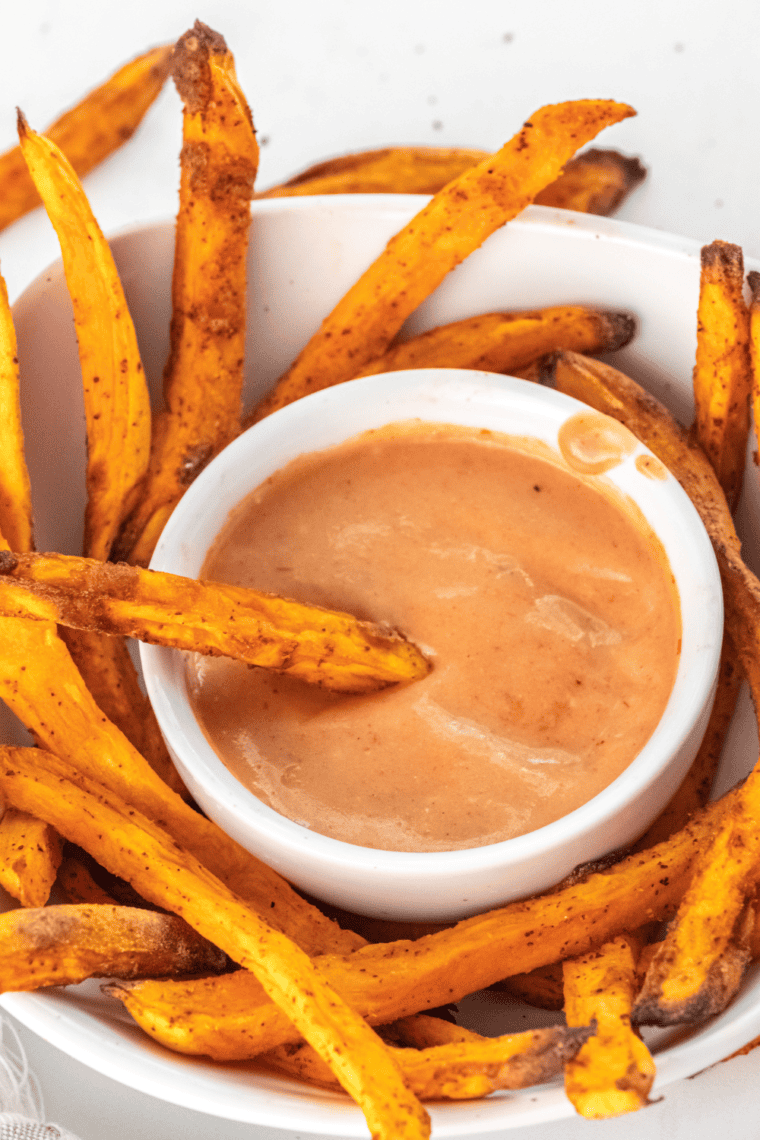 A bowl of homemade A&W Spicy Chipotle Dipping Sauce with a side of crispy fries for dipping.