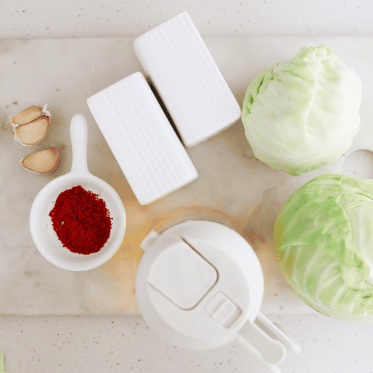 Ingredients for Air Fryer Cabbage Chips including fresh cabbage leaves, olive oil, and seasonings.