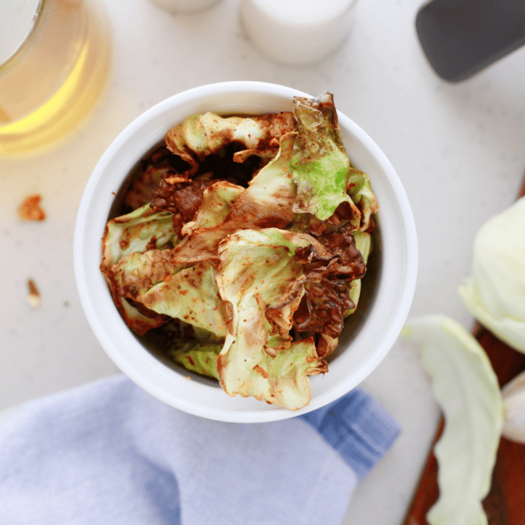 Golden and crispy Air Fryer Cabbage Chips served in a bowl.