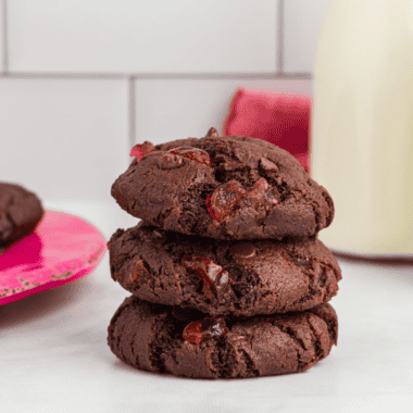 Air Fryer Chocolate Cherry Cookies fresh out of the air fryer, showing their gooey chocolate centers and chewy texture with vibrant cherry pieces.