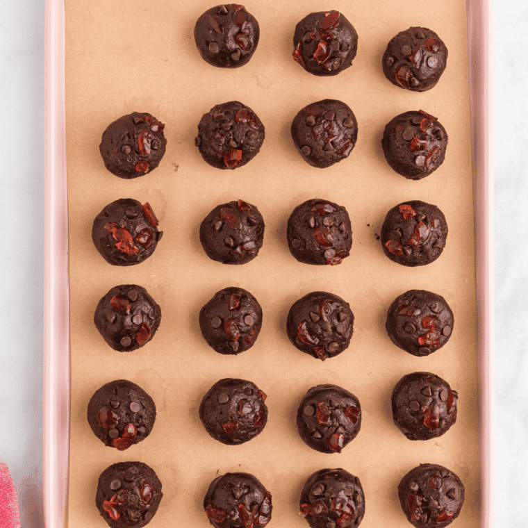 Scoop 2-tablespoon portions of dough onto a parchment-lined baking sheet, shaping into round balls.