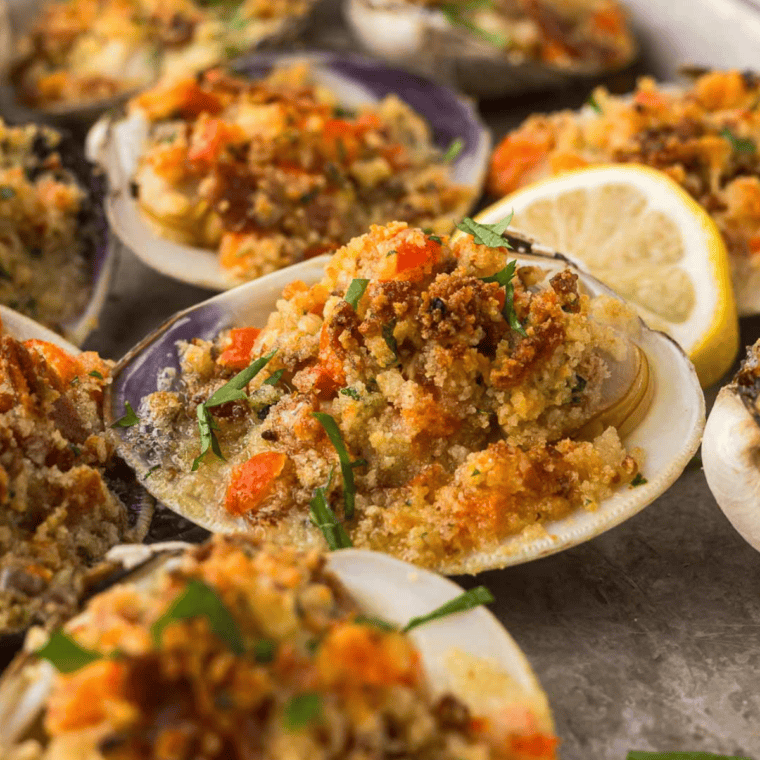A plate of perfectly crisp Air Fryer Clam Casino topped with golden breadcrumbs, crispy bacon, and fresh herbs, ready to serve as a delicious appetizer.