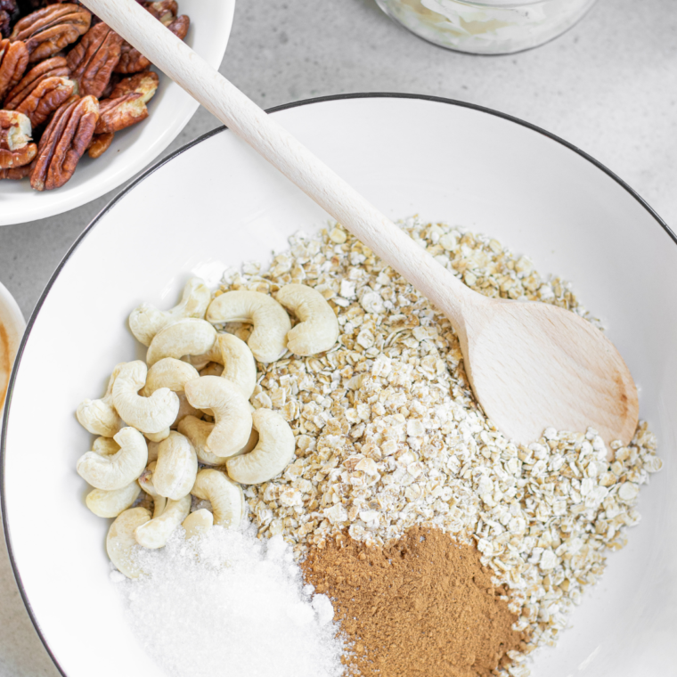 Mixing nut butter, honey, vanilla extract, and a pinch of salt into the dry ingredients, coating everything evenly before preheating the air fryer to 320°F (160°C) for 3-5 minutes.