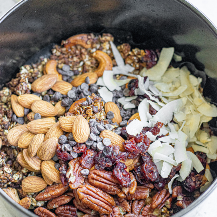 Air fryer protein granola made with oats, protein powder, nut butter, and honey, served as a crunchy snack or breakfast topping.