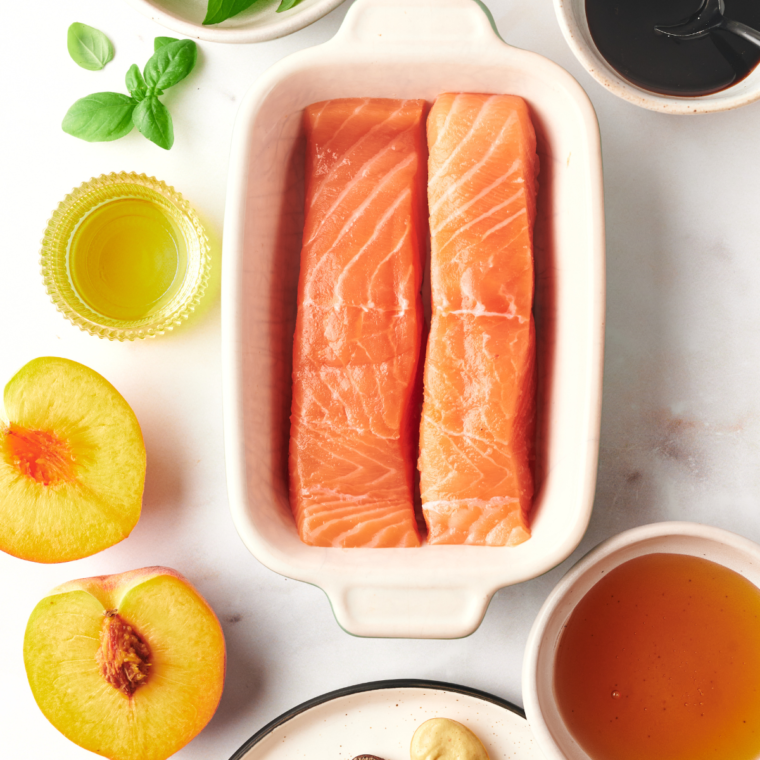 Ingredients needed for Air Fryer Peach Salmon on kitchen table.