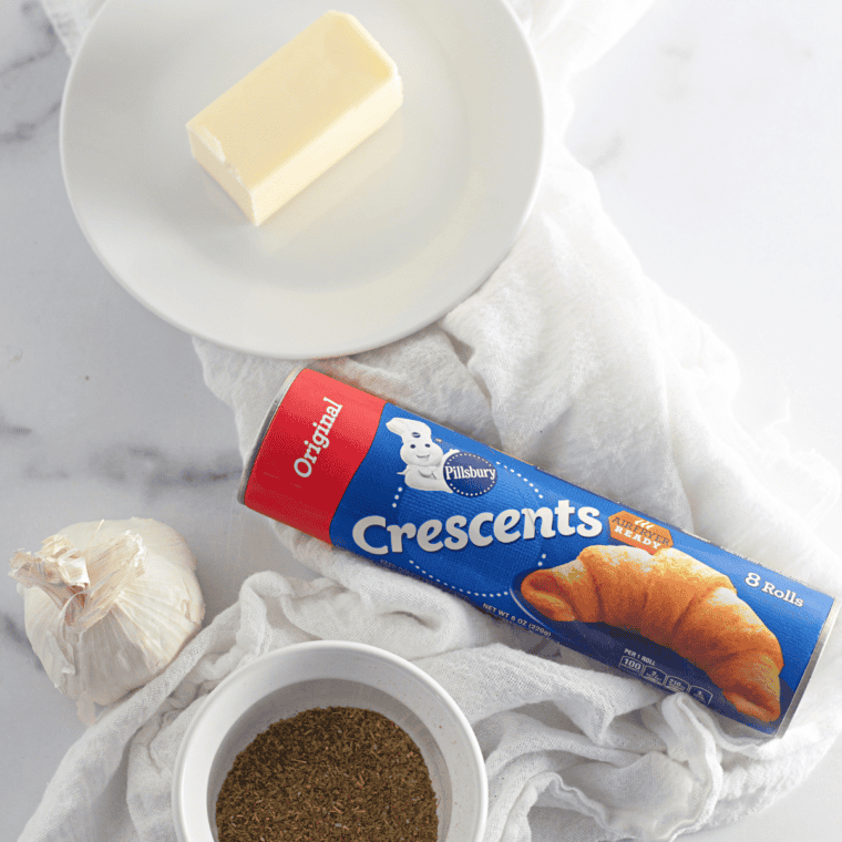 Ingredients needed for Cheddars Honey Butter Croissants on kitchen table.