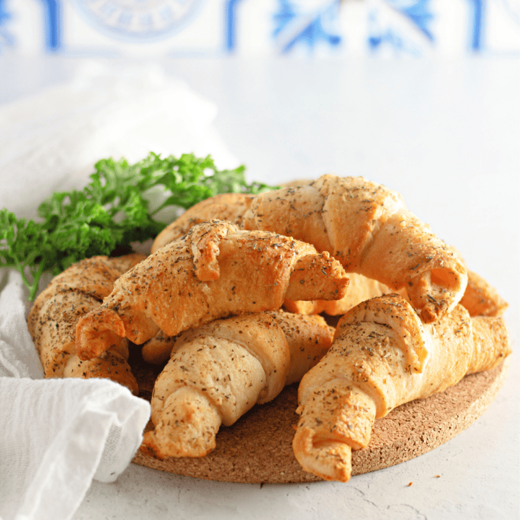 Freshly baked Cheddar's Honey Butter Croissants, golden and flaky, brushed with a sweet honey butter glaze.