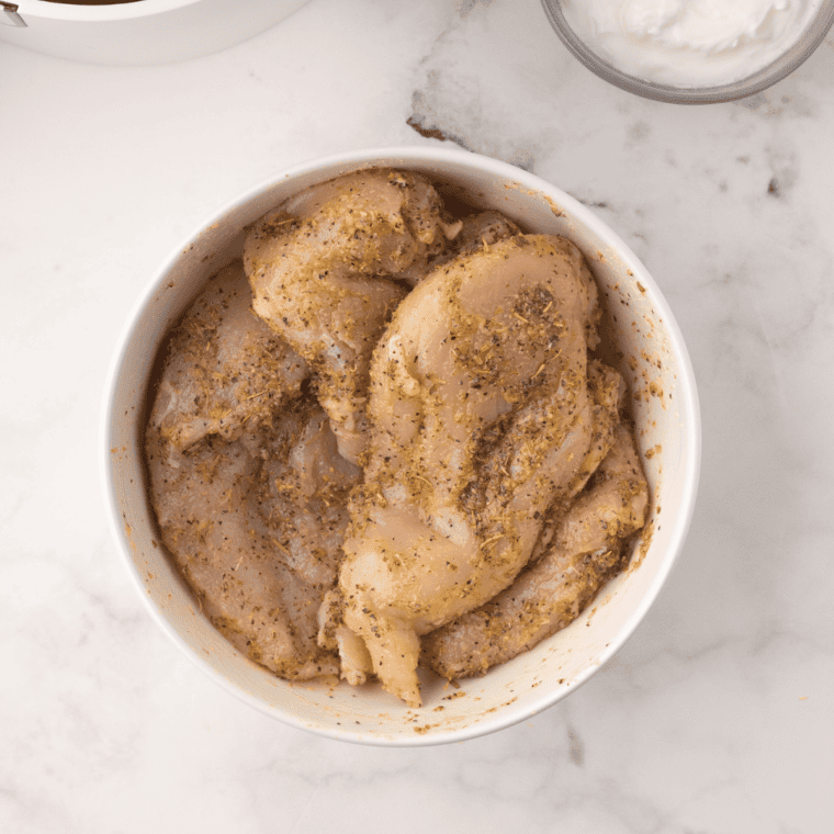 Falafel or chicken seasoned with Mediterranean spices including cumin, paprika, and garlic powder, ready for cooking.