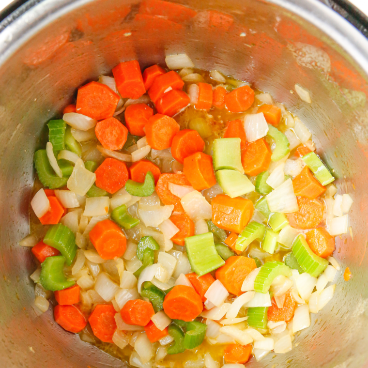 Cooking chicken in a large pot of broth and sautéing vegetables like onions, carrots, and celery in melted butter for a flavorful soup base.