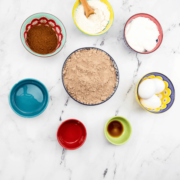 Ingredients needed for Copycat Portillo’s Chocolate Cake Recipe on kitchen table.