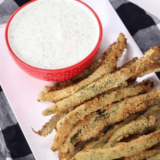 Crispy Green Beans PF Chang’s Copycat Recipe served on a plate with dipping sauce.