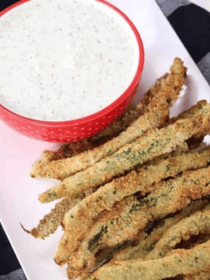 Crispy Green Beans PF Chang’s Copycat Recipe served on a plate with dipping sauce.