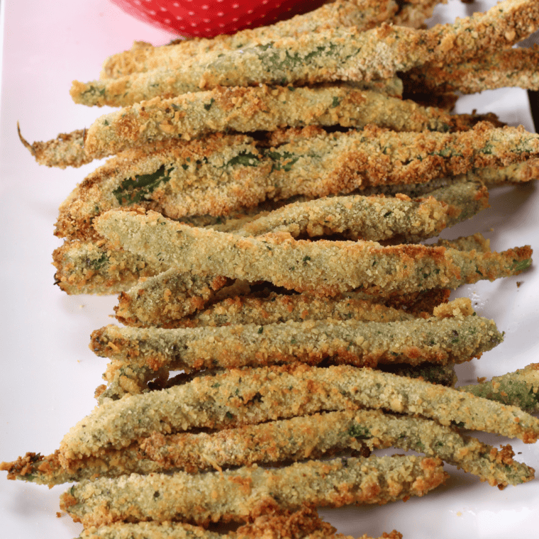 Golden, crispy green beans served as a PF Chang’s copycat recipe, showcasing a crispy batter coating and perfectly fried texture.