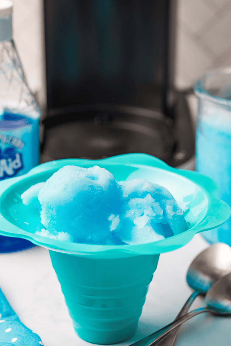 Close-up of a scoop of Ninja Creami Blue Raspberry Italian Ice in a bowl, showcasing its vibrant blue color and icy, smooth texture.







