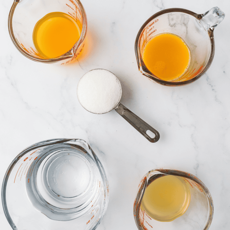 Ingredients needed for Ninja Creami POG Sorbet on kitchen table.