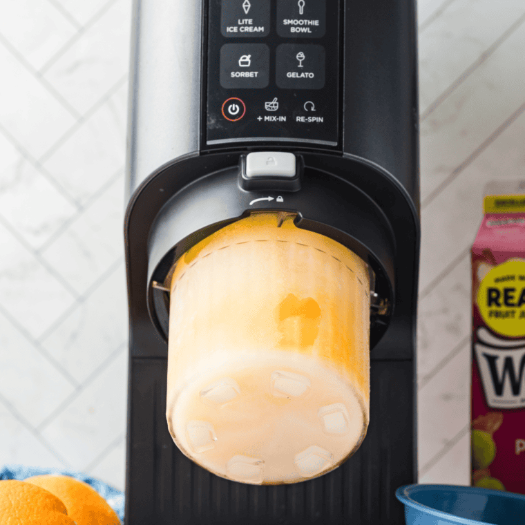 Remove the frozen pint from the freezer, take off the lid, and place it in the Ninja Creami machine. Select the Sorbet function to churn until smooth and creamy.