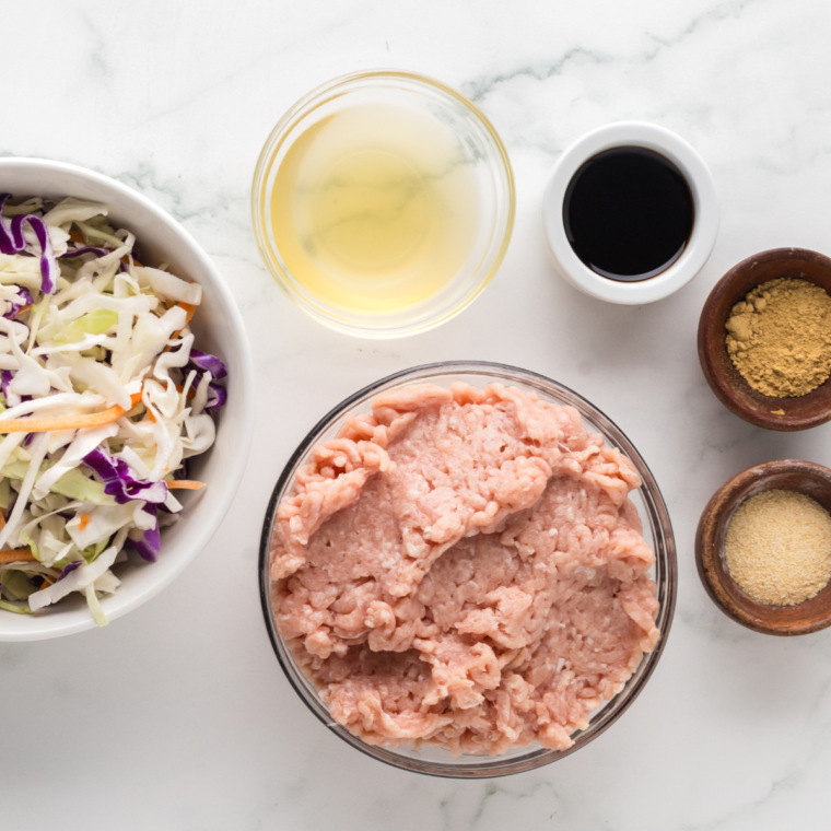 Ingredients needed for Ninja Foodi Chicken Egg Roll Bowls on kitchen table.