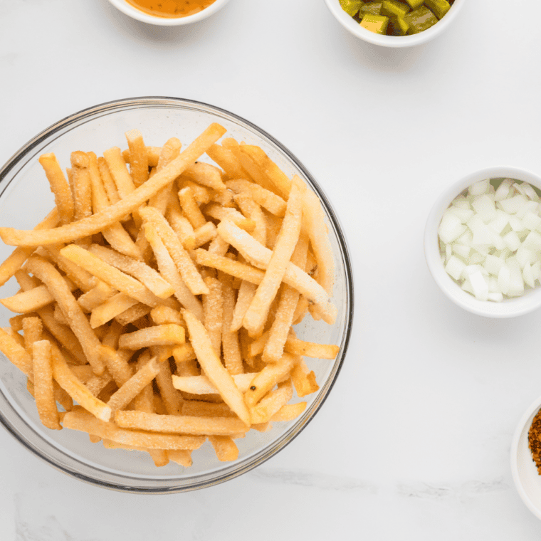 Ingredients needed for Red Robin Parmesan Garlic Fries Recipe on kitchen table.