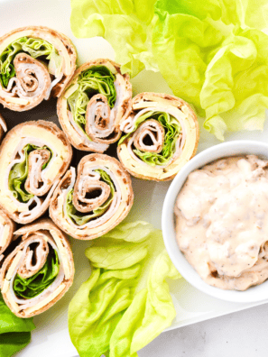 Sun-dried tomato spread made with cream cheese, mayonnaise, and spices in a small bowl.