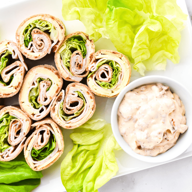 Sun-dried tomato spread made with cream cheese, mayonnaise, and spices in a small bowl.