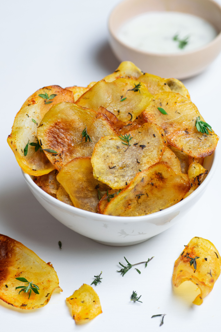 Golden Air Fryer All Dressed Potato Chips served in a white bowl, perfect for snacking.