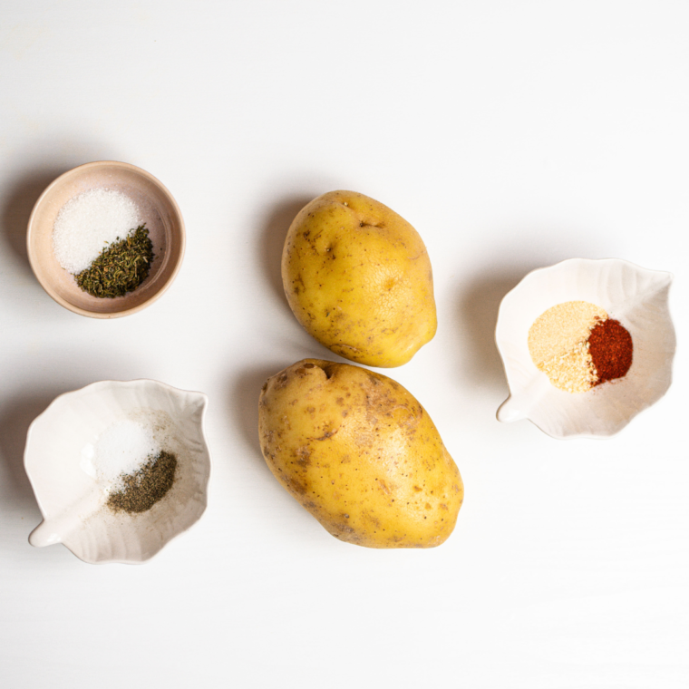 Ingredients needed for Air Fryer All Dressed Potato Chips on kitchen table.