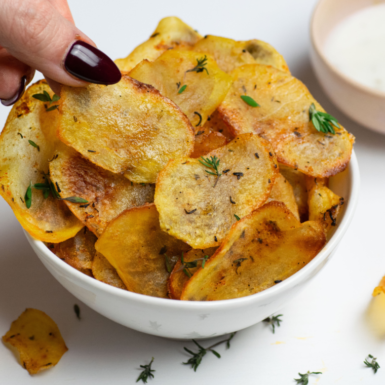 Thinly sliced potatoes air-fried to crispy perfection, coated with bold All Dressed seasoning.