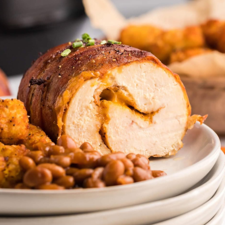 Air fryer bacon wrapped chicken breasts with crispy bacon and tender chicken inside