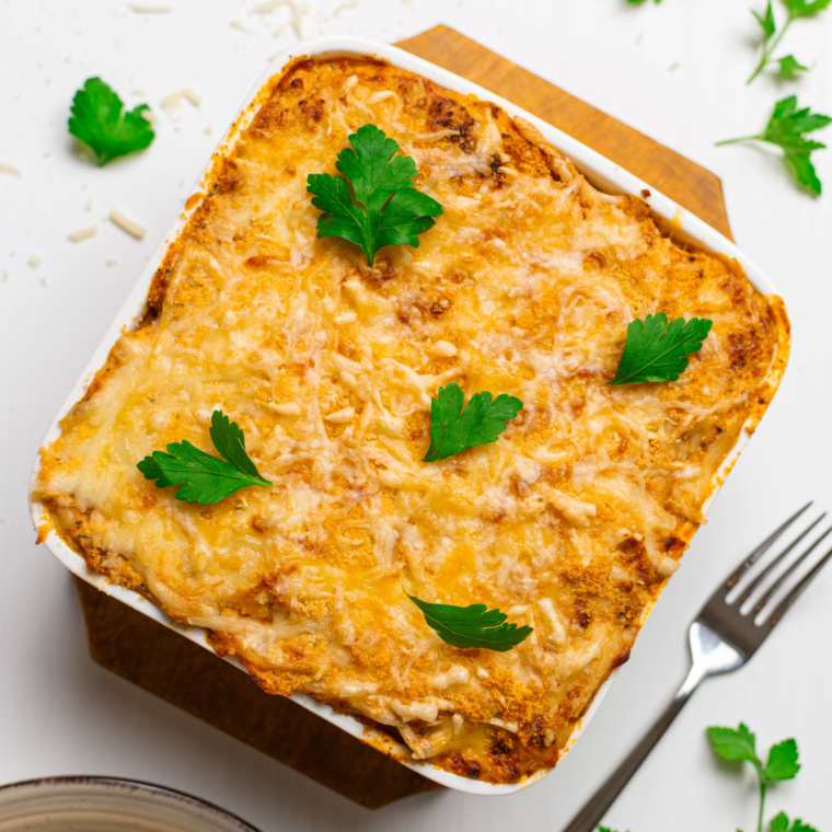 Cheesy and golden Air Fryer Baked Spaghetti served fresh in a casserole dish.