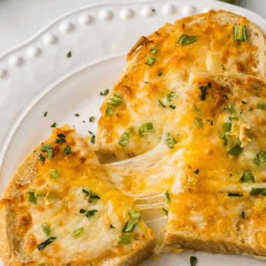 Air Fryer Chili Cheese Toast with crispy bread topped with chili and gooey melted cheese, ready for a satisfying bite.