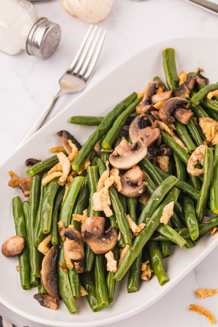 Air Fryer Green Beans with Mushrooms and Onions cooked to perfection with crispy fried onions on top.