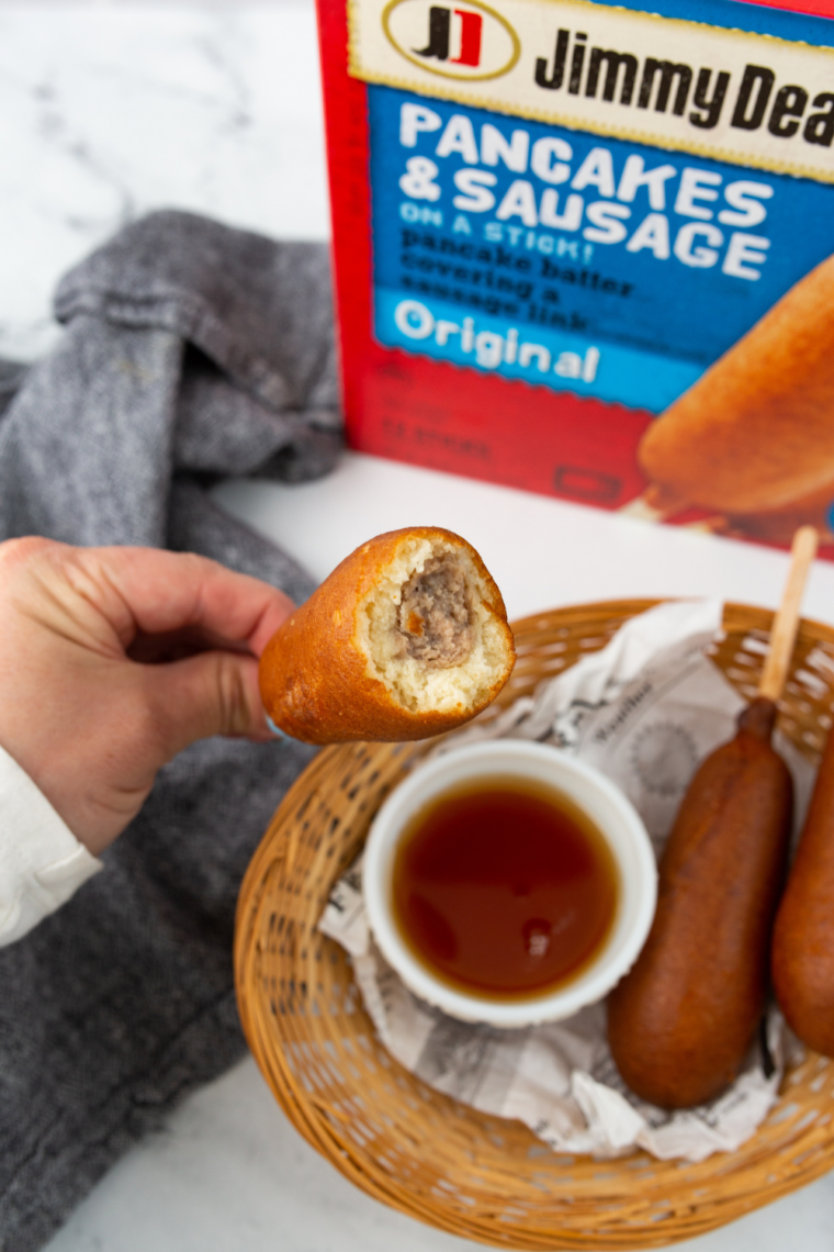 Frozen Jimmy Dean pancake sausage sticks cooking in air fryer until golden brown and crispy