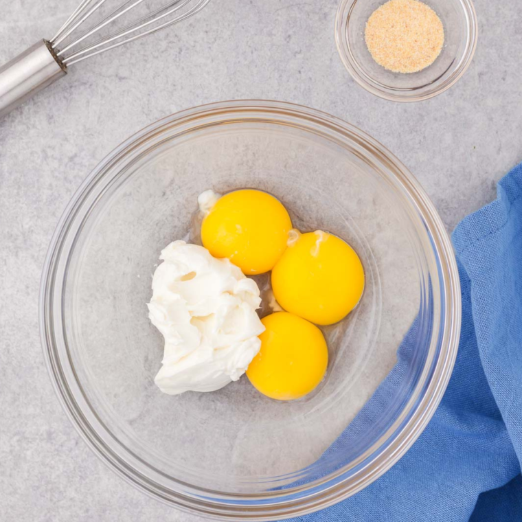 Preheat the air fryer to 300°F (150°C) while separating the egg whites from the egg yolks in the bowl to ensure fluffy clouds.