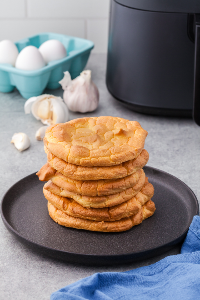 Crispy Air Fryer Keto Cloud Bread Slices come in a bowl and showcase a golden, crunchy texture.