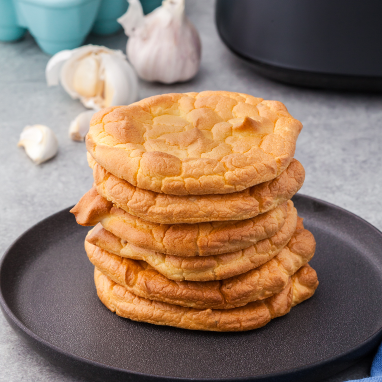 Golden Brown Air Fryer Keto Cloud Bread Slices serve as a crispy, low-carb snack on your plate.