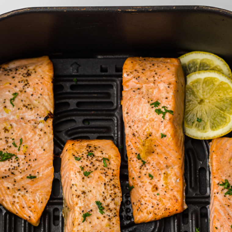 Air Fryer Salmon Bowl featuring crispy salmon, fresh vegetables, and a flavorful sauce, served in a bowl for a nutritious meal.