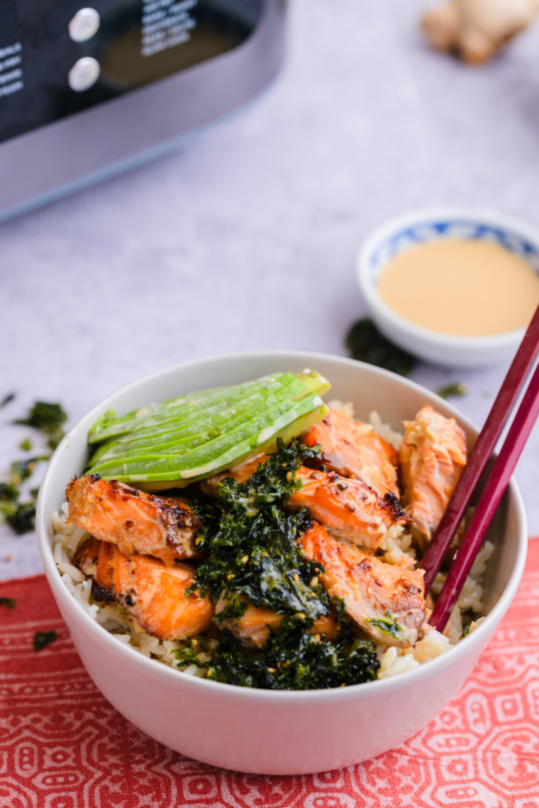 Air Fryer Salmon Bowl featuring crispy salmon, fresh vegetables, avocado, and a savory sauce in a bowl for a healthy meal.