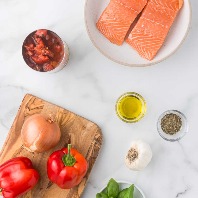 Ingredients needed for Air Fryer Salmon Cacciatore on kitchen table.