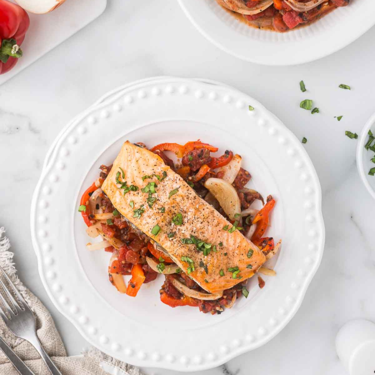 Air Fryer Salmon Cacciatore served with tomatoes, olives, and herbs for a delicious Italian-inspired dish.