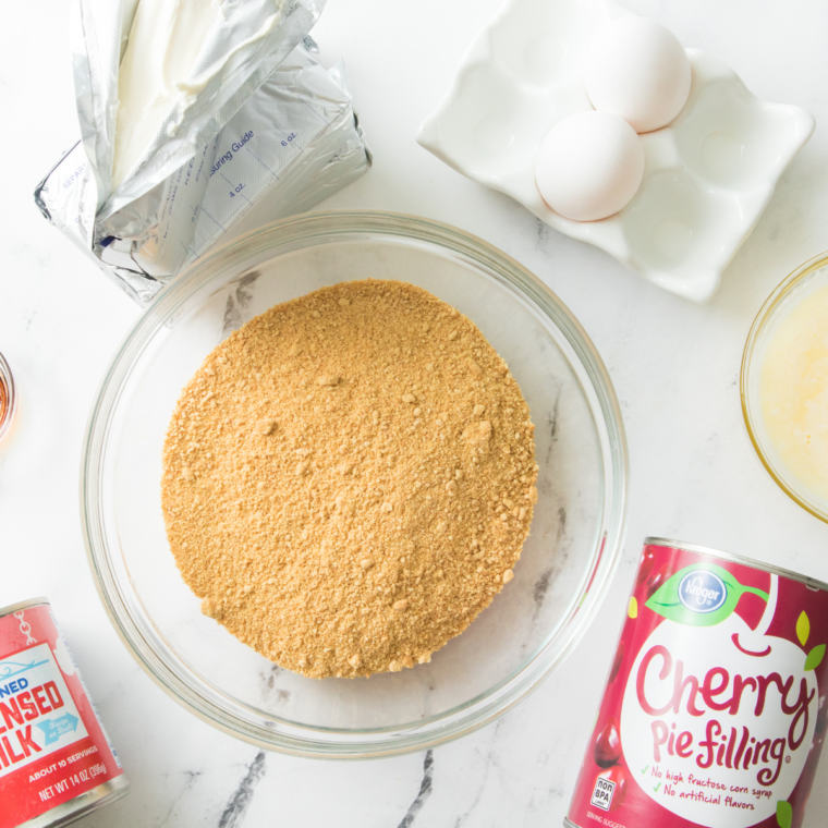 Ingredients needed for Air Fryer Cherry Cheesecake on kitchen table.