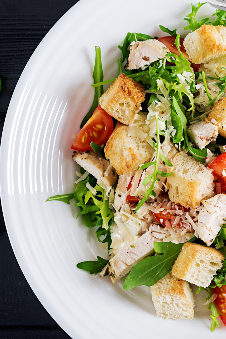 Discover a flavorful Chicken Tikka Salad, featuring tender chicken marinated in spices and yogurt, served on a fresh bed of mixed greens with a tangy dressing. Perfect for a healthy and satisfying meal.