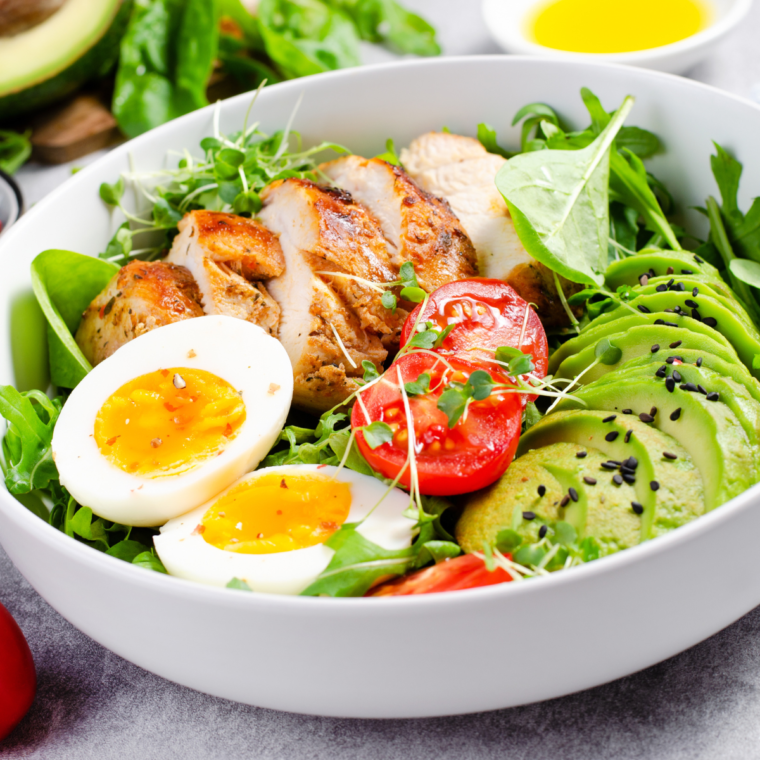 Chicken Tikka Salad with grilled chicken, fresh veggies, and a creamy dressing.